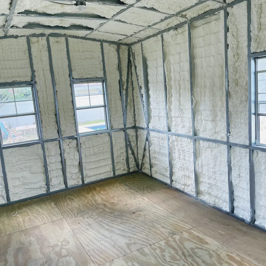 Closed-cell spray foam insulation applied to wall cavities in a residential project in Leonia